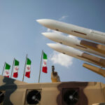 Iran’s 400kg Uranium Stockpile Makes This TERRIFYING… Missiles on launchers beside Iranian flags.