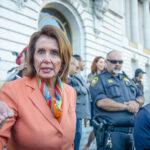 OUTRAGEOUS: Pelosi Portfolio Destroys Investors… Nancy Pelosi speaking outside a government building.
