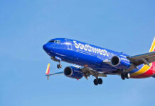 Jet Engine TEARS AWAY: Terrifying Crash Footage! Jet aircraft in flight against clear blue sky.