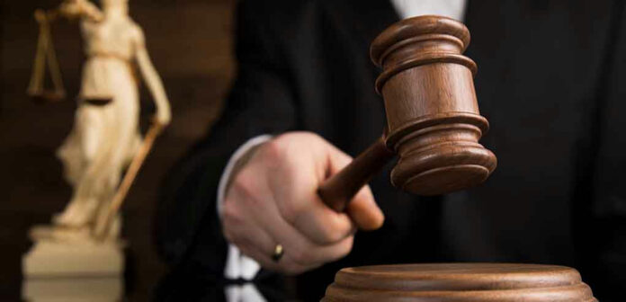 1352204627 Gavel being struck on a sound block.