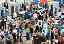 JUST IN: Atlanta Airport Turns Into Quarantine Zone…. Crowd at an airport security checkpoint with TSA officers.