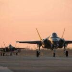 U.S. STRIKES Iran — Shocking Ceasefire Breach Jets on runway at sunset.