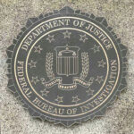 DOJ’s SHOCK Move: Key J6 Convictions Erased? Department of Justice, FBI seal on stone background.