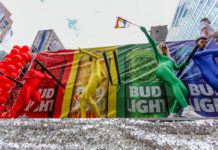 Pride Outbreak PANIC? Boston’s Bold Vaccine Blitz… Parade performers in rainbow bodysuits dancing on a float