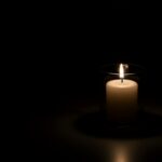 Cliff Rescue GONE WRONG — Army Scrambles… A lit candle in a glass holder against a dark background