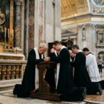 Vatican Call RISKS Re-Opening Global Christian WAR… Clergy members kneeling in prayer inside a grand cathedral