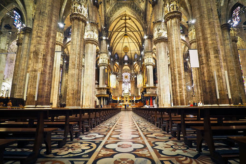 shutterstock_350911157 Interior of a grand cathedral with empty pews.