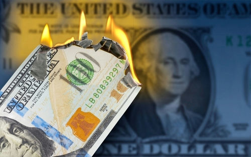 shutterstock2081222044jpg Burning US hundred-dollar bill with flames at the corner