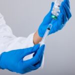 Trump Slashes Childhood Shots – CDC Rattled A healthcare professional preparing a syringe with a vaccine