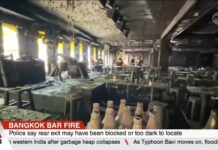 Bolted Door Turns Party Into Tomb Bangkok bar fire kills 27; police probe negligence over blocked emergency exits