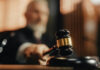 The Defamation Ruling That Shows What Happens When You Don’t Fight Back Judge's gavel striking sounding block in courtroom