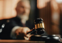 The Defamation Ruling That Shows What Happens When You Don’t Fight Back Judge's gavel striking sounding block in courtroom